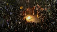 People protest against Prime Minister Benjamin Netanyahu's government and call for the release of hostages held in the Gaza Strip by the Hamas militant group, in Tel Aviv, Isr