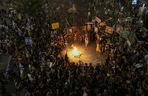 People protest against Prime Minister Benjamin Netanyahu's government and call for the release of hostages held in the Gaza Strip by the Hamas militant group, in Tel Aviv, Isr