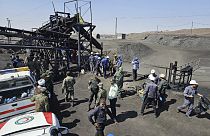 Miners and police officers at coal mine where methane leak sparked an explosion on Saturday, in Tabas, some 540 kilometres  southeast of Tehran, Iran