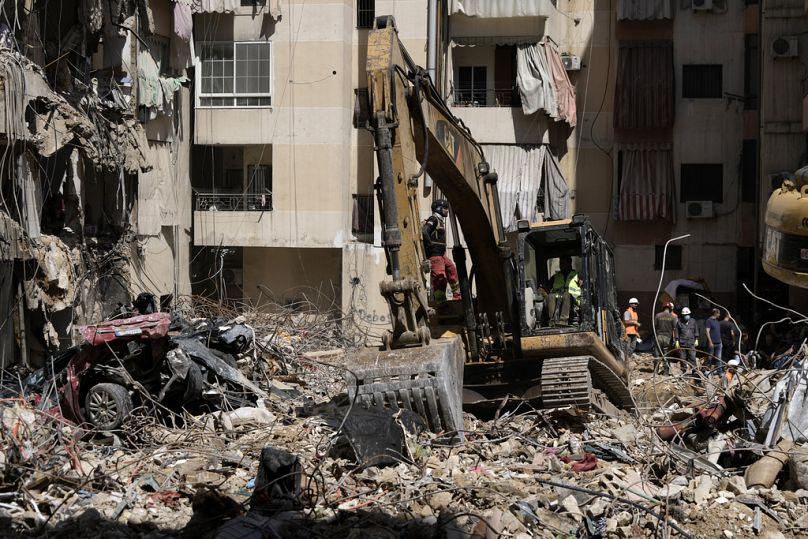 Emergency workers clear the rubble at the site of Friday's Israeli strike in Beirut's southern suburb, Sunday 22 September, 2024. 