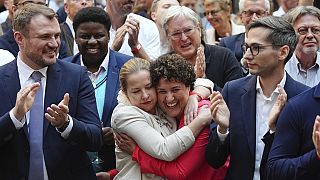 Supporters of Dietmar Woidke, Brandenburg's Minister President and Chairman of the SPD in Brandenburg, celebrate after the first forecasts for the state election in the German