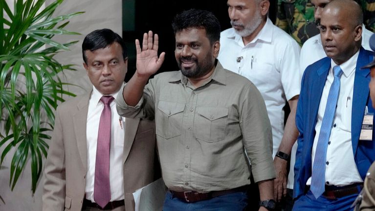 Anura Kumara Dissanayake waves as he departs the election commission office after winning the presidential election in Colombo, Sri Lanka, Sunday, Sept. 22, 2024. 