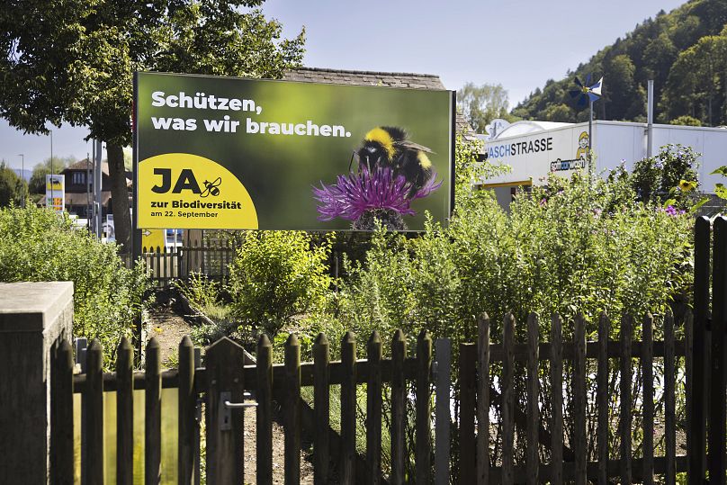 A poster for the Yes campaign is seen in a garden ahead of a biodiversity referendum due to take place on Sept. 22, in Belp, Switzerland, Saturday, 