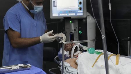 A man who was injured in the explosion of one of the handheld devices, lies inside an operation room ahead of an eye surgery at the Eye Specialist hospital, in Beirut, Lebanon