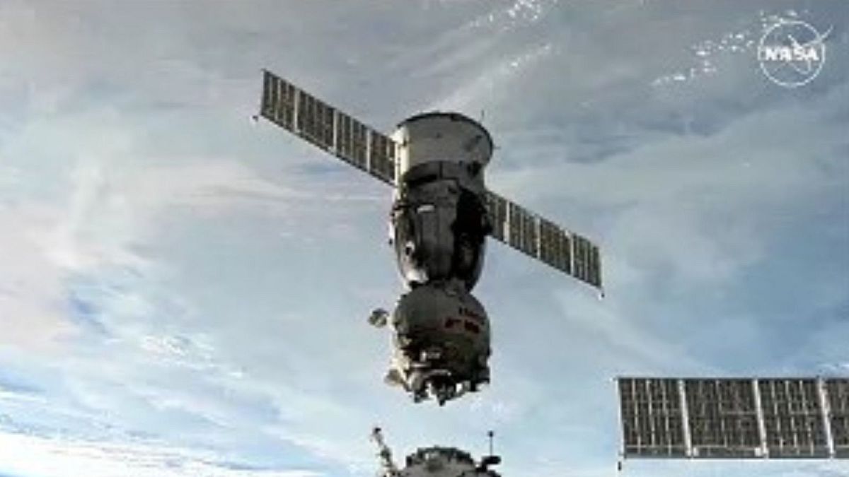 Soyuz space capsule carries 2 Russians and 1 American back from International Space Station