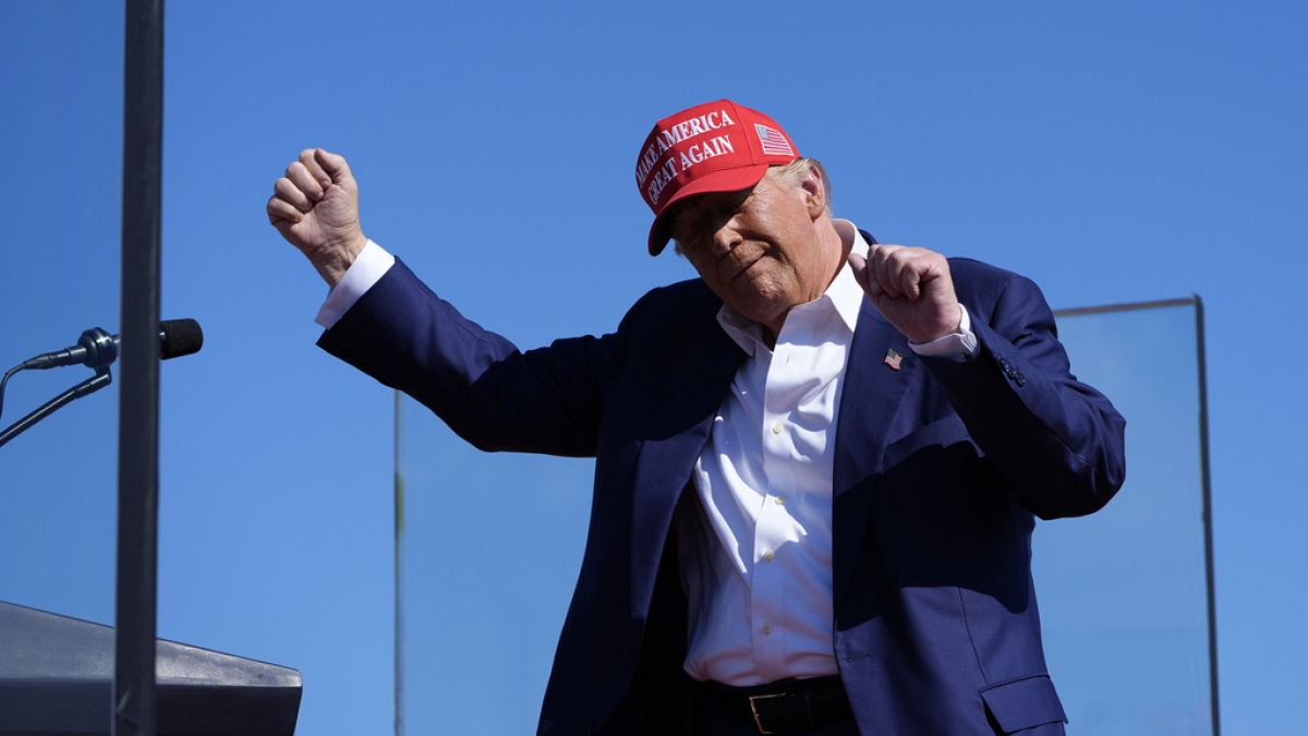 Republican presidential nominee former President Donald Trump dances after speaking at a campaign rally at Wilmington International Airport, Saturday, Sept. 21, 2024.