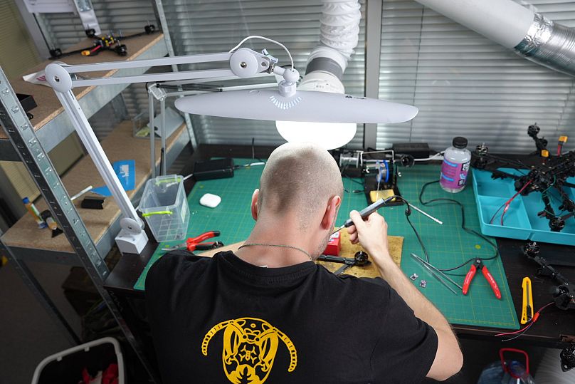 An engineer building a drone.