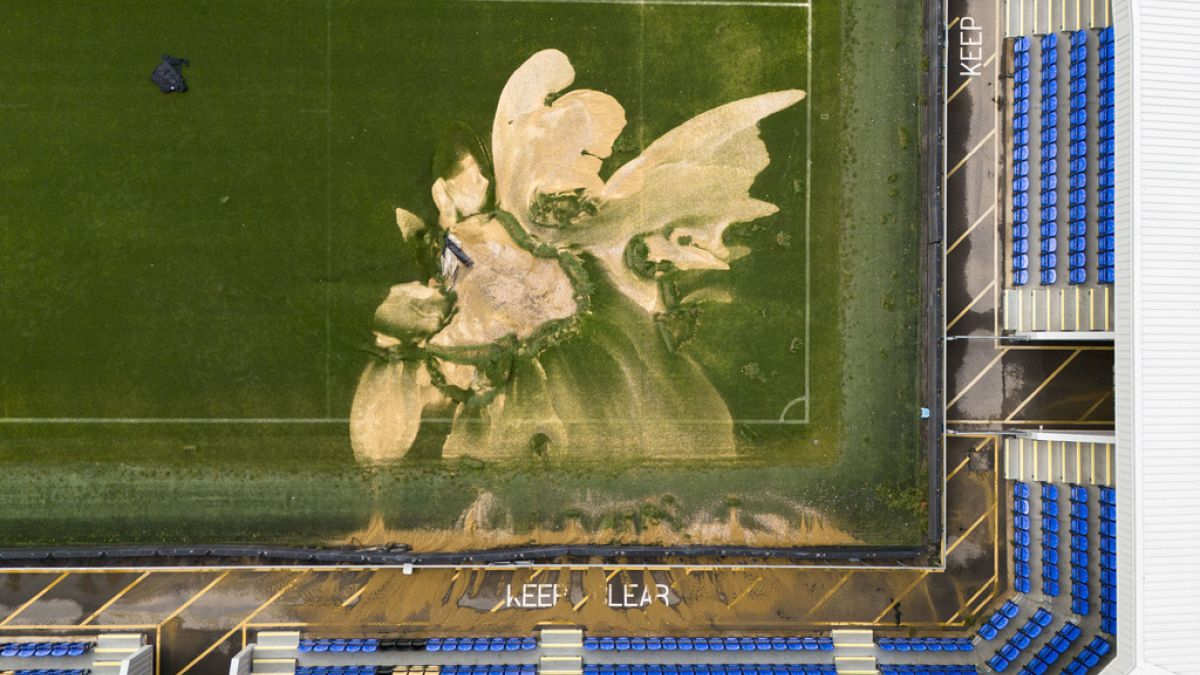 Football pitch collapses as parts of the UK hit by flash floods