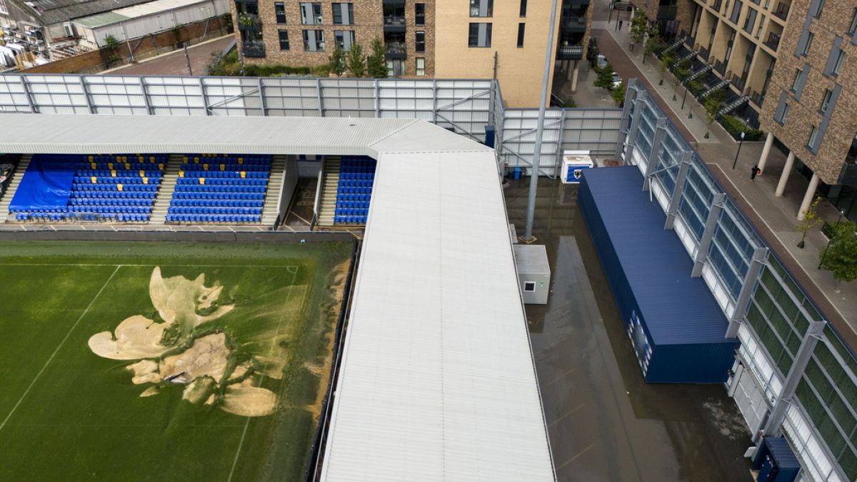 An aerial view of a sinkhole on the pitch and flooded walkways at the Cherry Red Records Stadium, home of AFC Wimbledon, in London, Sept. 23, 2024, after heavy rainfall