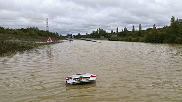 A view of an open boot of a car visible, submerged in flood water after heavy rainfall, on the A421 in Marston Moretaine, Bedfordshire, England, Monday, Sept. 23, 2024