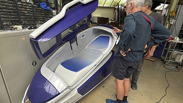 Dr Philip Nitschke, front, stands next to a "suicide pod" known as "The Sarco" in Rotterdam, The Netherlands, July 8, 2024. Dr Philip Nitschke, front, stands next to a "suicide pod" known as "The Sarco" in Rotterdam, The Netherlands, July 8, 2024.