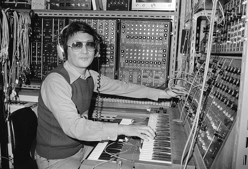 A one-man orchestra, Isao Tomita makes electronic music in his component-filled studio in Tokyo, June 30, 1976. 