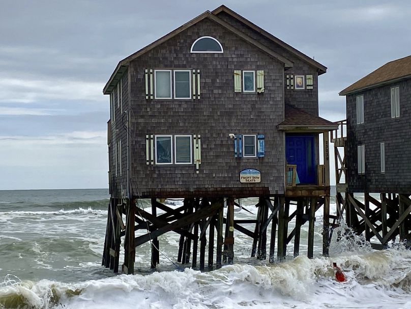 his photo provided by Cape Hatteras National Seashore shows a house several hours before it collapsed into the ocean in Rodanthe.