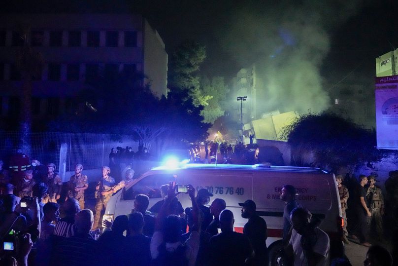 Ambulances arrive at the site of an Israeli airstrike in Beirut's southern suburbs Friday, Sept. 27, 2024.