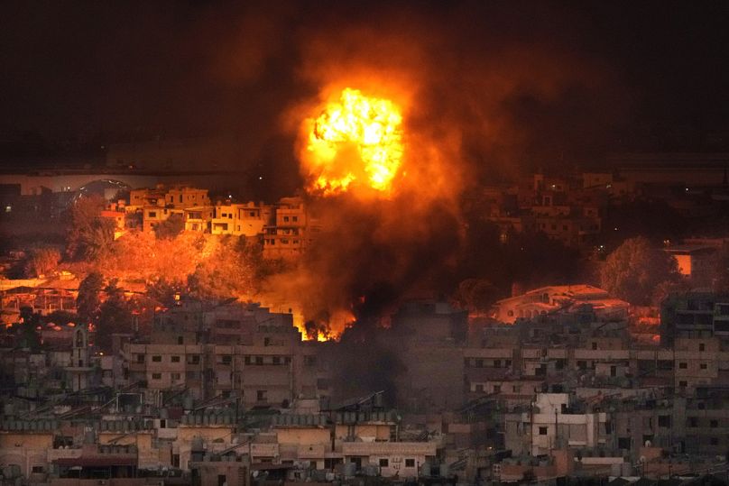 Flames rise after an Israeli airstrike in the southern suburbs of Beirut, Lebanon, Saturday, Sept. 28, 2024.