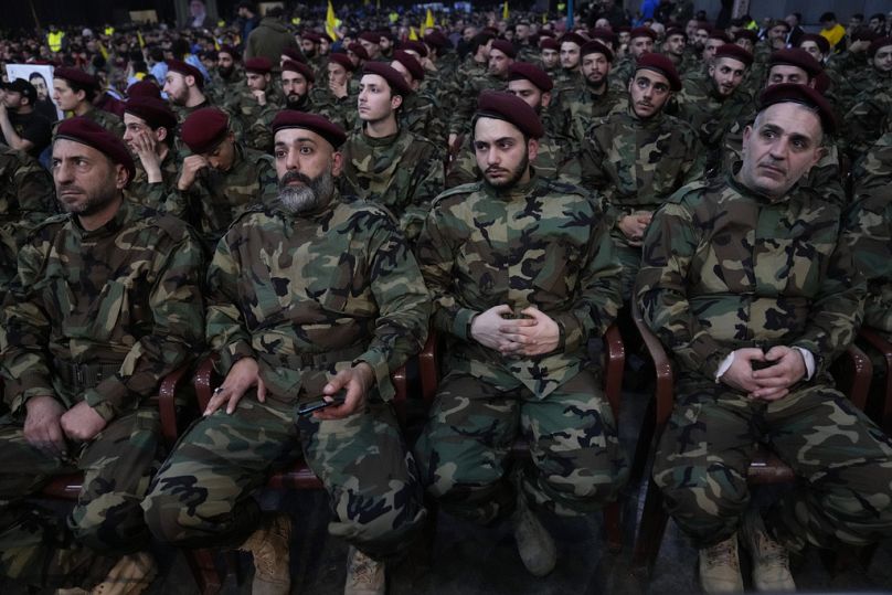 FILE - Hezbollah fighters listen to the speech of their leader Sayyed Hassan Nasrallah, April 14th 2023