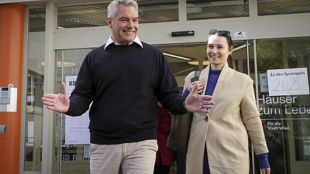 Austrian Chancellor Karl Nehammer smiles while exiting a polling station in Vienna, Austria, Sunday, Sept. 29, 2024, 