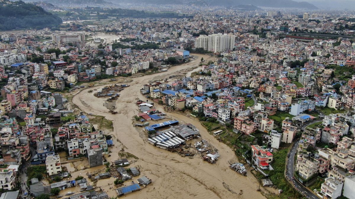 Flooding and landslides in Nepal kill at least 129 and dozens more missing