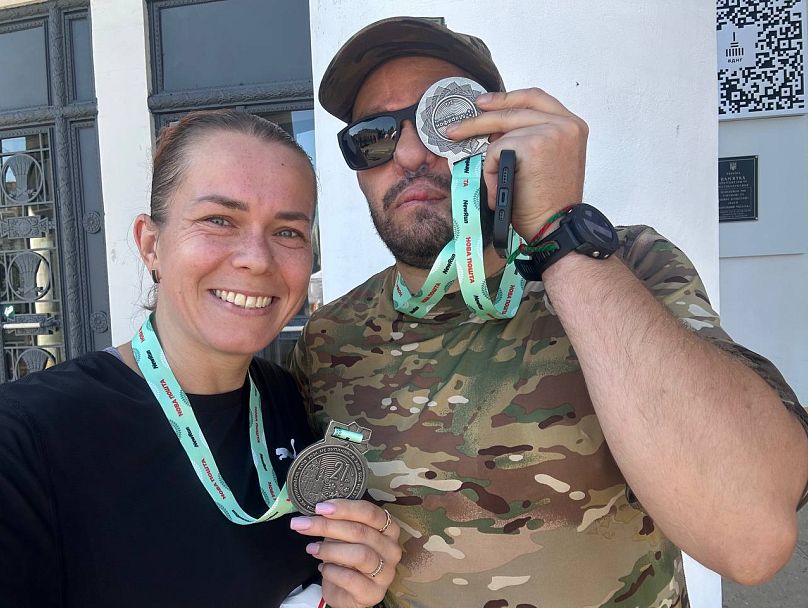 Dmytro and his wife after the Nova Post marathon in Kyiv.