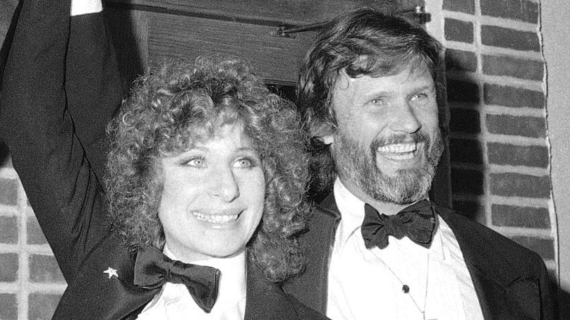 Barbra Streisand and Kris Kristofferson appear at a preview of the film "A Star is Born" - December 1976