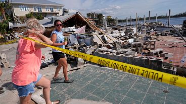Owners and employees of Roy's Restaurant survey the business that was destroyed by the storm surge, in the aftermath of Hurricane Helene, Florida. Owners and employees of Roy's Restaurant survey the business that was destroyed by the storm surge, in the aftermath of Hurricane Helene, Florida.