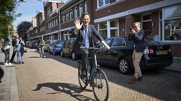 Mark Rutte on his bicycle after voting in 2019 EU elections Mark Rutte on his bicycle after voting in 2019 EU elections