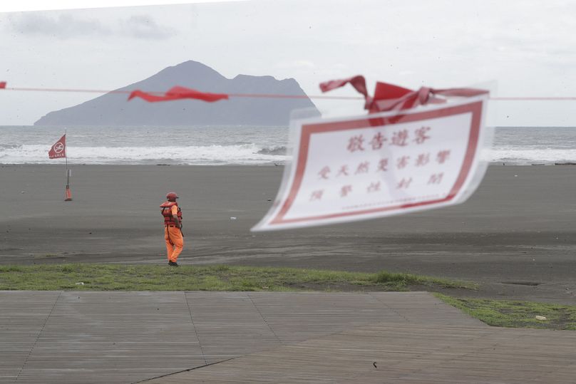 A soldier of Coast Guard Administration guards on the beach as Typhoon Krathon approaches to Taiwan in Yilan County, eastern coast of Taiwan, Tuesday, Oct. 1, 2024. 