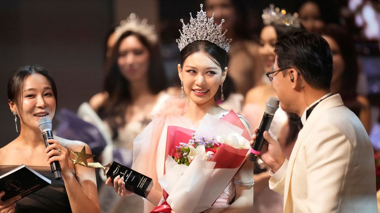 Han Ariel, a 22-year-old fashion school student, celebrates after winning the 2024 Miss Universe Korea