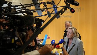 Marine Le Pen arrives with her lawyer Rodolphe Bosselut at a trial over misuse of EU funds.