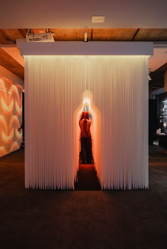 A visitor explores the Uniqlo exhibition at the Pavillon Vendôme, Paris.