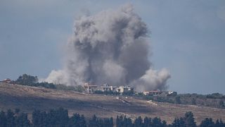 An Israeli airstrike hits an area in southern Lebanon as seen from northern Israel, 2 October 2024