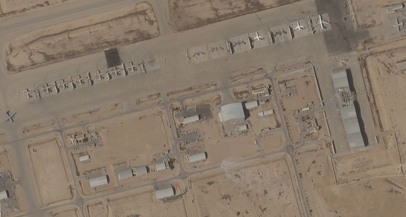 This satellite image taken by Planet Labs PBC shows a damaged hangar at Israel's Nevatim Air Base.