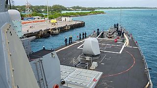 This photo provided by the U.S. Navy on Feb. 11, 2023 shows U.S. Navy Sailors aboard the USS Paul Hamilton (DDG 60) during a routine port visit at Diego Garcia.