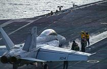 FILE - An F/A-18 Super Hornet prepares to launch off the flight deck of the Nimitz-class aircraft carrier USS Theodore Roosevelt  onJuly 5, 2024, in the South China Sea. 