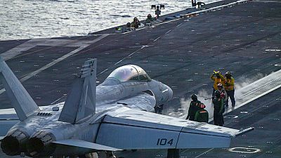 FILE - An F/A-18 Super Hornet prepares to launch off the flight deck of the Nimitz-class aircraft carrier USS Theodore Roosevelt  onJuly 5, 2024, in the South China Sea. 