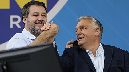 Italy's right-wing League party leader Matteo Salvini, left, with Hungarian Prime Minister Viktor Orban in Pontida, north of Milan, Italy, Sunday, Oct. 6, 2024. 