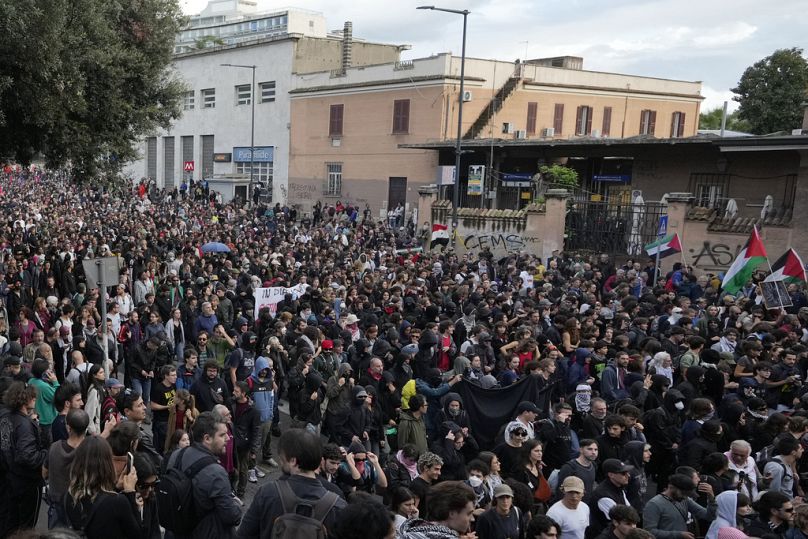 People attend at a protest in Rome, Saturday, Oct. 5, 2024. Pro-palestinians people take to the street in an unauthorised march in the centre of Rome two days ahead of the fir
