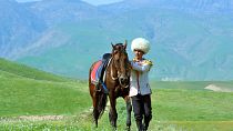 Turkmen man and his Akhal-Teke horse