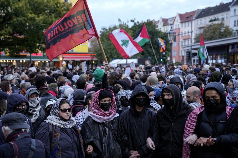 People take part in a pro-Palestinian rally in Berlin, Monday, Oct. 7, 2024. 