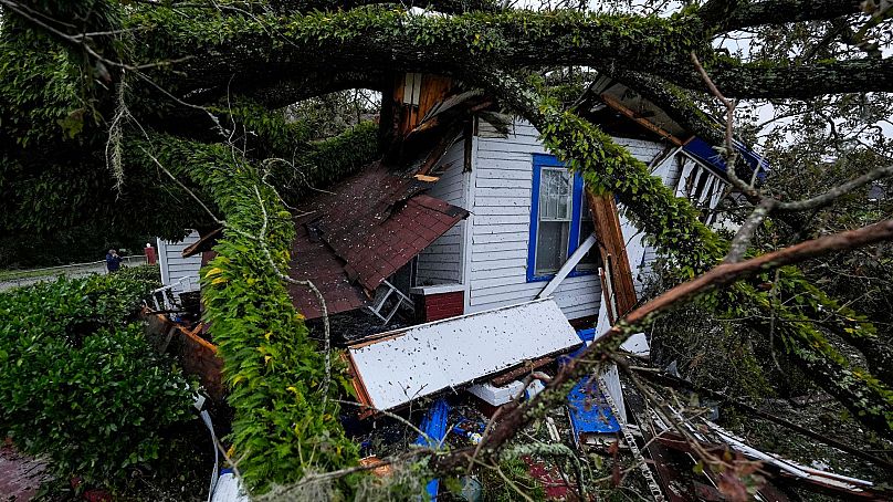 A damaged 100-year-old home is seen after an Oak tree landed on it after Hurricane Helene moved through the area, Sept. 27, 2024, in Valdosta, Ga. 