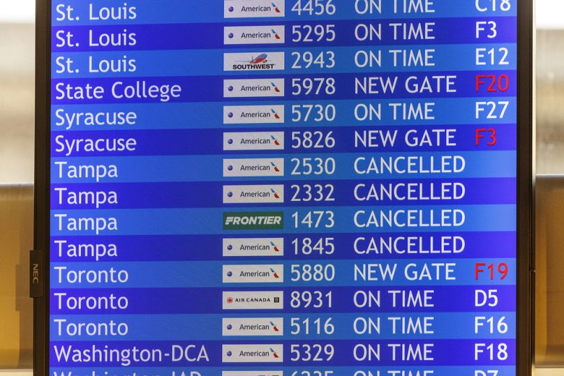 Flight information board with cancelled flights to Tampa is shown on Wednesday, Oct. 9, 2024 at the Philadelphia International Airport. 