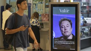 An ad by Valor media shows a photo of Elon Musk at a shopping center in Brasilia, Brazil, Monday, Sept. 2, 2024.