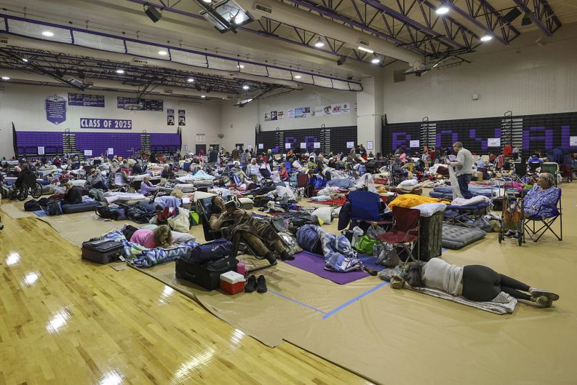 A view of some of the 700 evacuees in the gymnasium in shelter at River Ridge Middle/High 