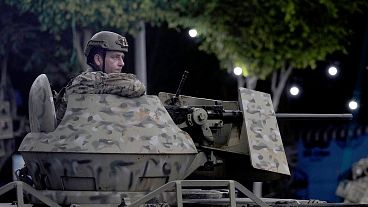 FILE: A Lebanese army soldier sits behind his weapon atop of an APC at the site of an Israeli airstrike in Beirut's southern suburb, 23 September 2024 FILE: A Lebanese army soldier sits behind his weapon atop of an APC at the site of an Israeli airstrike in Beirut's southern suburb, 23 September 2024