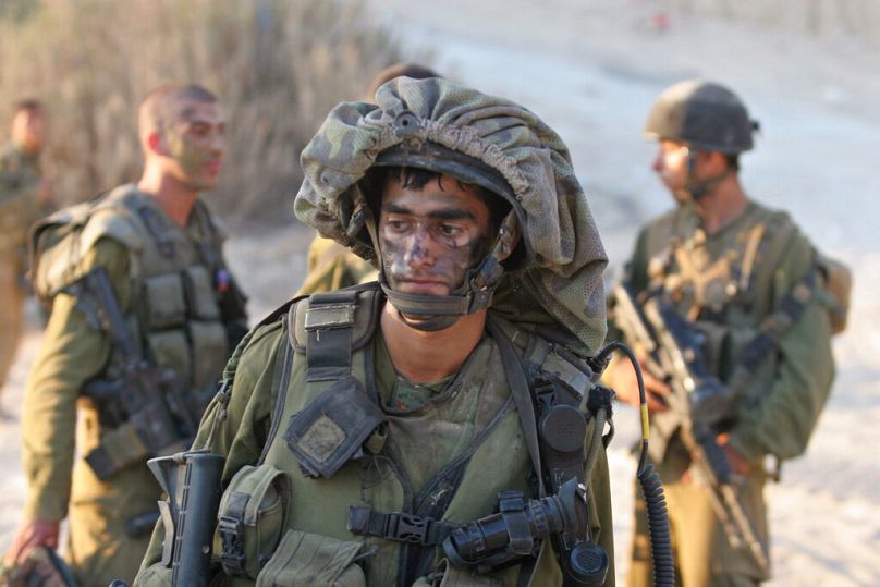 Israeli soldiers return from south Lebanon Friday Aug. 18, 2006.