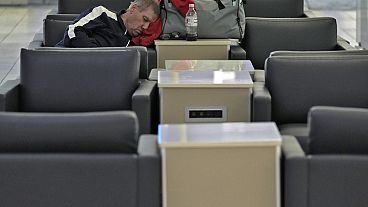 Travel chaos: A passenger sleeps at the Tampa International Airport on Tuesday after most flights were canceled due to the arrival of Hurricane Milton Travel chaos: A passenger sleeps at the Tampa International Airport on Tuesday after most flights were canceled due to the arrival of Hurricane Milton