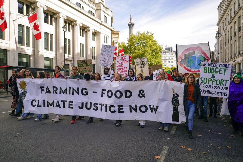 Farmers, food producers and food system workers take part in a march to demand more government ambition on UK food and farming policy in October 2022