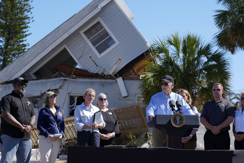 President Joe Biden speaks in front of a damaged building in St. Pete Beach, Florida during a tour of areas affected by Hurricane Milton on Sunday