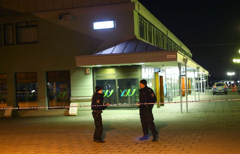 Police officers examine the scene of a fatal shooting in Gothenburg, Sweden, late Wednesday, March 18, 2015.