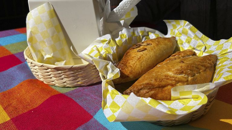 A basket of Mexican pastes sit on a patron's table before they are eated for lunch at the 16th International Paste Festival in Mineral del Monte